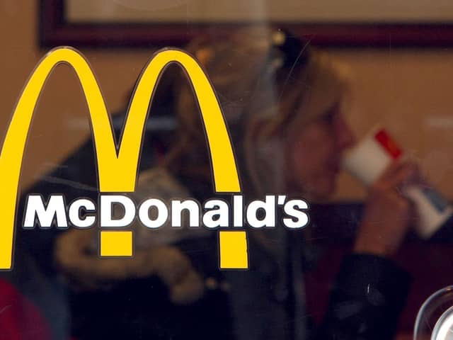 A McDonald's customer is seen through the window at a McDonald's restaurant