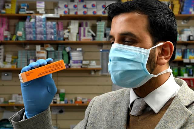 Photo Neil Cross. Staff at Leyland Late Night Pharmacy are wearing face masks and gloves, as a precaution against coronavirus. Owner Rizwan Akhtar