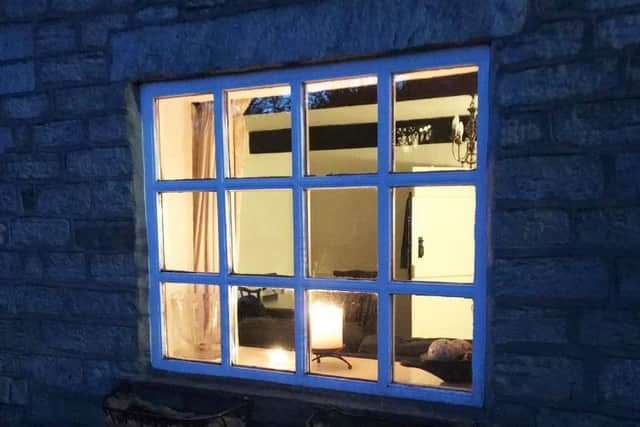 A candle in the window of a property in Brindle for a National Day of Prayer prompted by the coronavirus