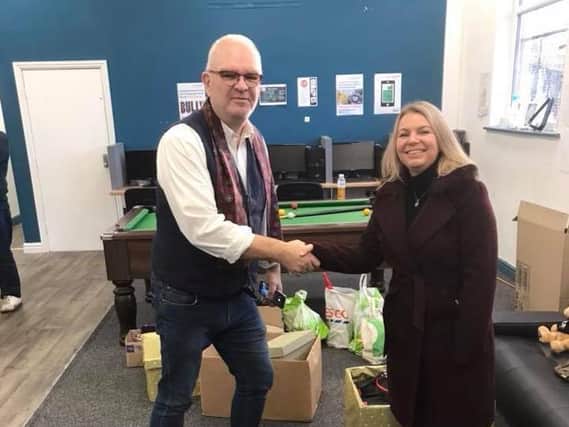 Jeff Marsh, Foxton Centre CEO, receiving a donation to the Preston homeless shelter.