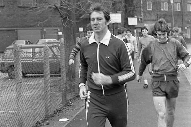 Alan Kelly leads the Preston North End squad down Lowthorpe Road to the training pitch in December 1983