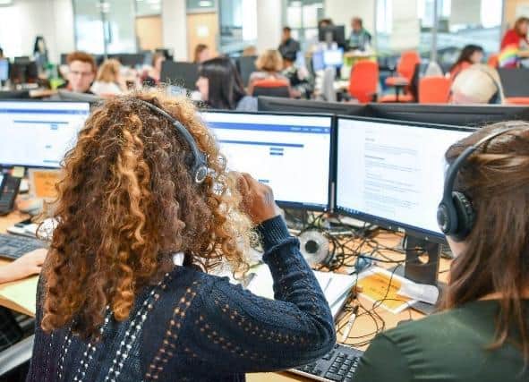 Call centre workers such as these could be at risk if social distancing cannot be practised during the coronavirus pandemic and should work from home warn MPs