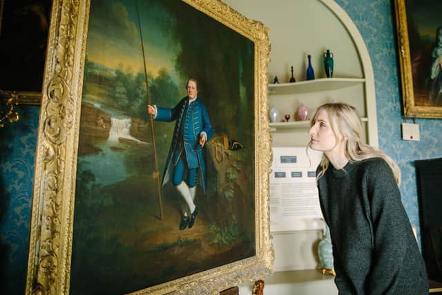 Steven Barber.  Taking a closer look at the painting by George Romney. Picture credit: National Trust/Steve Barber.