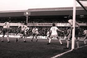 Preston centre-half Mick Baxter gets in a header against Lincoln City in the FA Cup in 1977, watched by team-mate Alex Bruce (No.11)