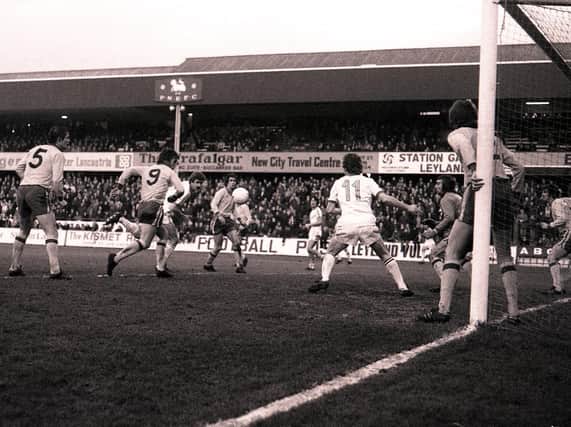 Preston centre-half Mick Baxter gets in a header against Lincoln City in the FA Cup in 1977, watched by team-mate Alex Bruce (No.11)