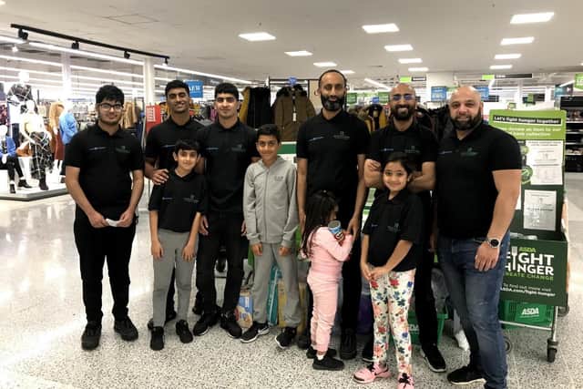 Noor food bank volunteers at Asda, which donated items.