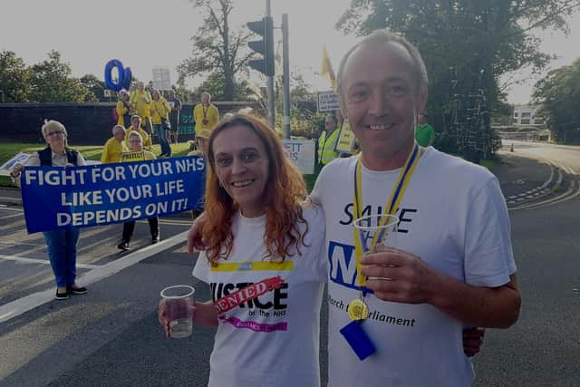 Jenny Hurley pictured outside Chorley A&E last year with James Corbett at the halfway point in his NHS-inspired 400-mile walk to Westminster