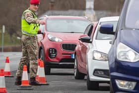 A member of the Royal Military Police 150 Provost Company, works alongside North Yorkshire Police, at a vehicle check point near Catterick Barracks in Yorkshrie