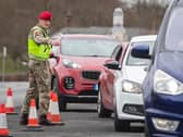 A member of the Royal Military Police 150 Provost Company, works alongside North Yorkshire Police, at a vehicle check point near Catterick Barracks in Yorkshrie