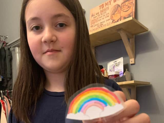 Holly with one of her badges
