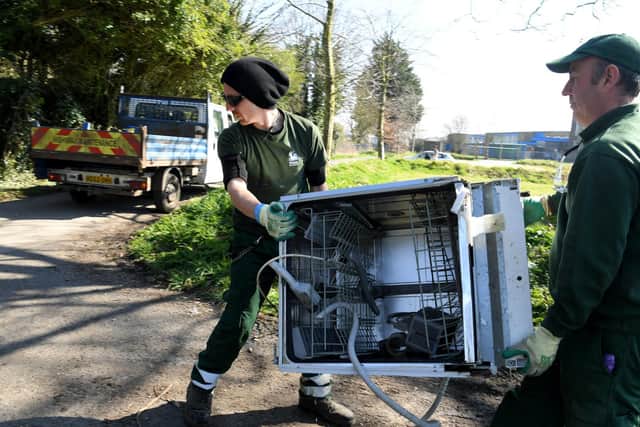 Park staff remove a flytipped appliance from Avenham Park