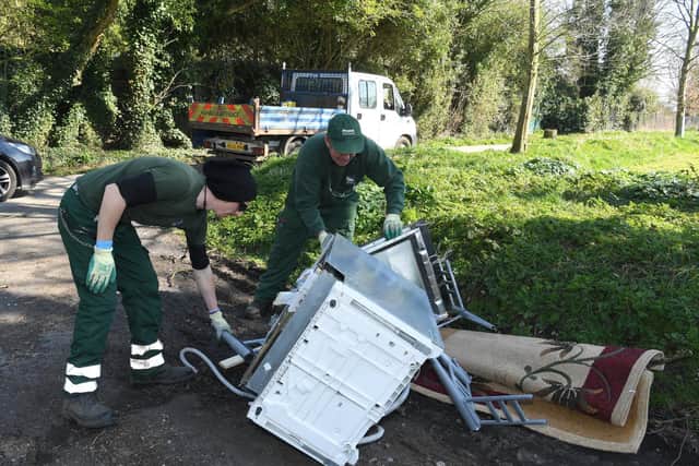 Park staff remove a flytipped appliance and rug from Avenham Park