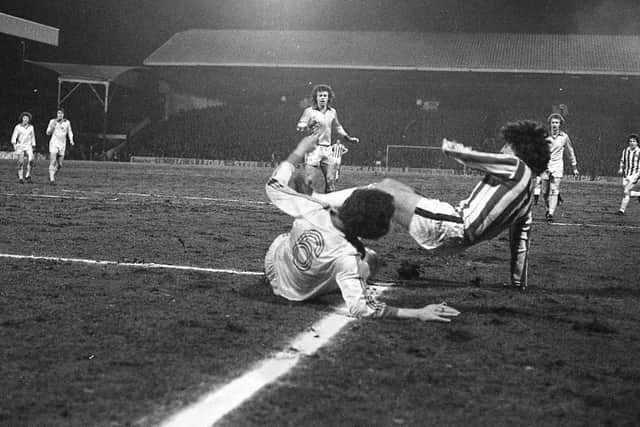 Preston defender Don O'Riordan slides into a challenge against Stoke City at the Victoria Ground in February 1979
