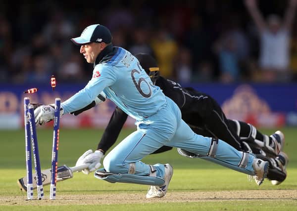 Jos Buttler takes the winning wicket in the World Cup final