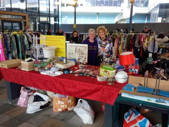 Auntie Celia's fundraising stand at Preston market (Celia on the right)