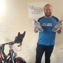 Michael Brennand with new shoes he had bought himself to run for Rosemere Cancer Foundation in the London Marathon,