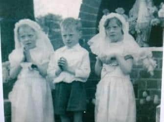 At a church May procession aged 5. From L to R: Pauline, John, Teresa