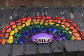 The rainbow pebble art on Scale Hall.