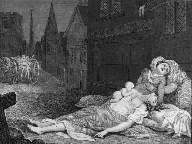 A family lies dead and dying in the street while a cart carries away corpses of those who have already succumbed to the plague in 1665