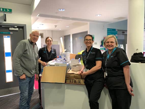 Eldon Primary sponsored Andy Bradshaw, who has recovered from coronavirus, hands over some of the  equipment to staff at Royal Preston Hospital