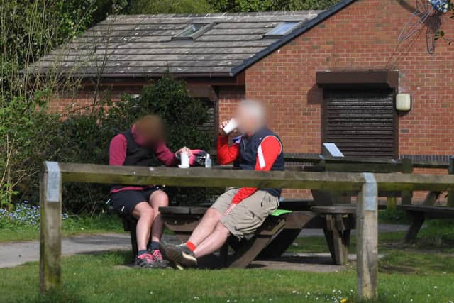 One couple sit down for a snack at Longton beauty spot Brickcroft Nature Reserve