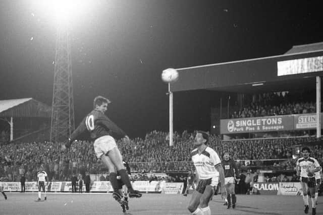 PNE defender Bob Atkins looks on as Chorley's No.10 gets in a header at Deepdale