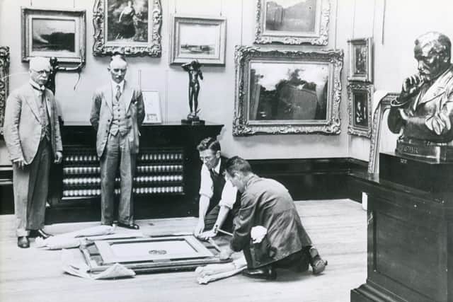 Artwork being taken to places of safety from Preston Art Gallery a few days before the outbreak of the Second World War, looking on are Coun J Harrison, chairman of the free public library committee, and Sydney Paviere, gallery curator