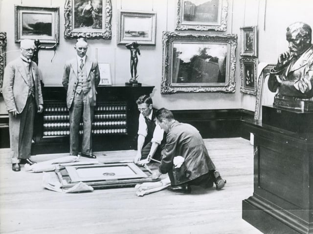 Artwork being taken to places of safety from Preston Art Gallery a few days before the outbreak of the Second World War, looking on are Coun J Harrison, chairman of the free public library committee, and Sydney Paviere, gallery curator