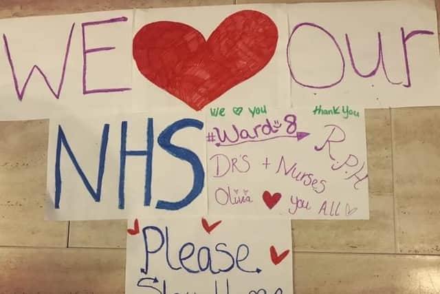 The family have made a poster showing their support for the NHS.