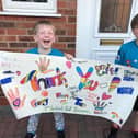 Theo and Freddy with their flag for the NHS and key workers.