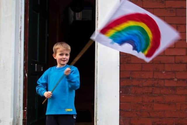 Elliot flying a flag that symbolises hope.