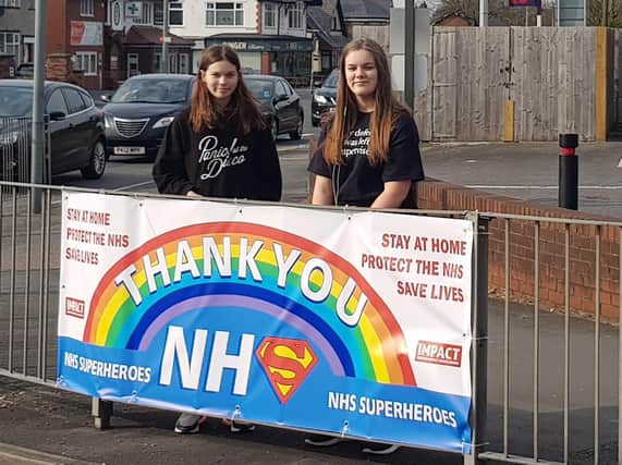 Young people from Preston Impact have made a banner to salute the work of the NHS and put it up on fencing close to the Royal Preston Hospital