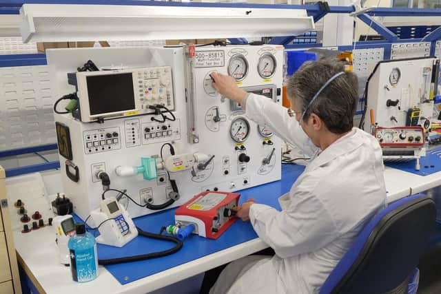 An employee from Smiths Medical tests one of the new ventilators bound for UK hospitals under the Ventilator Challenge UK  consortium