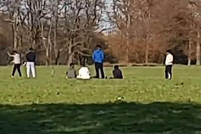 A large group of men flouting lockdown rules whilst playing cricket in Moor Park, Preston on Monday, April 13. Credit: Paul Winstanley