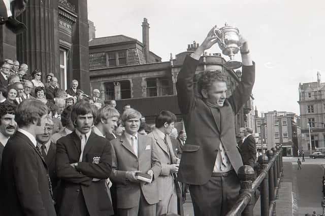 PNE manager Alan Ball Snr holds aloft the Third Division title trophy