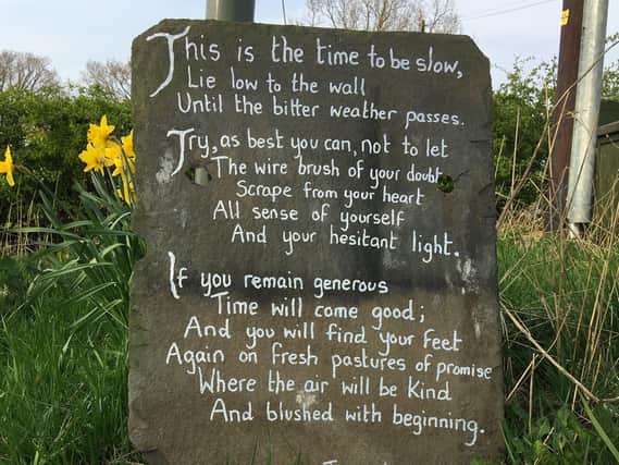 The poem handwritten on slate