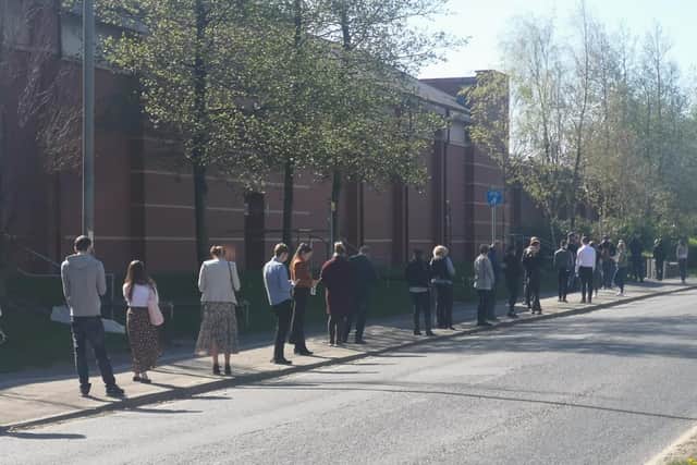 Around 150 people queue to apply for jobs as pickers and delivery drivers for Morrisons in Leyland