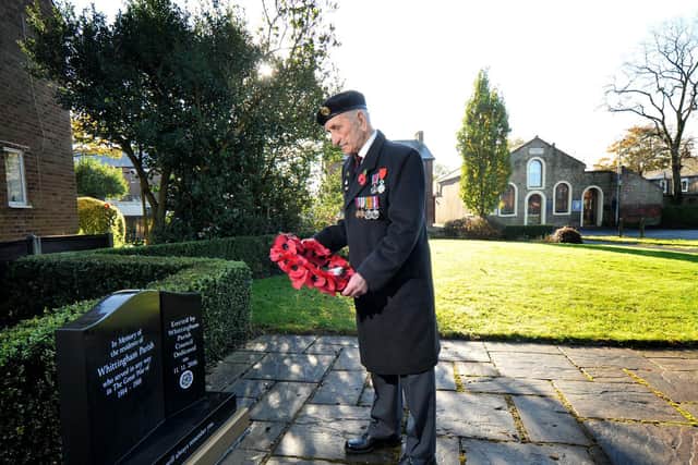Gerard Rogerson paying his respects at the war memorial in Whittingham