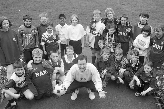 These soccer-loving youngsters from St Andrew's CE Primary School, Ashton, Preston, have plenty of reason to be cheerful - their PE teacher is none other than Preston North End star Steve Wilkinson. Steve offered to stand in and teach the pupils a few tricks while their PE teacher Sue Mortimer was off on maternity leave