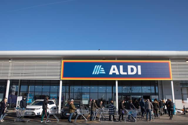 Shoppers queue outside an Aldi supermarket (Photo by Dan Kitwood/Getty Images)