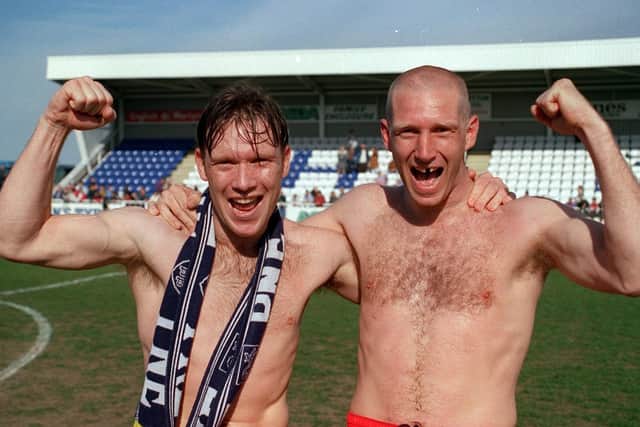 Simon Davey and Andy Saville celebrate bare-chested style after PNE win the Third Division title at Hartlepool