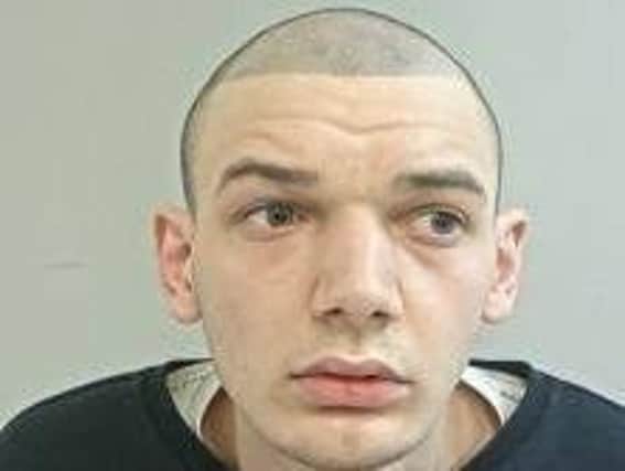 Cameron Parkinson, 20, from Preston, is wanted on prison recall after breaching the terms of his release. Pic: Lancashire Police