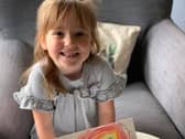 Arabella has been making rainbow friendship bracelets.