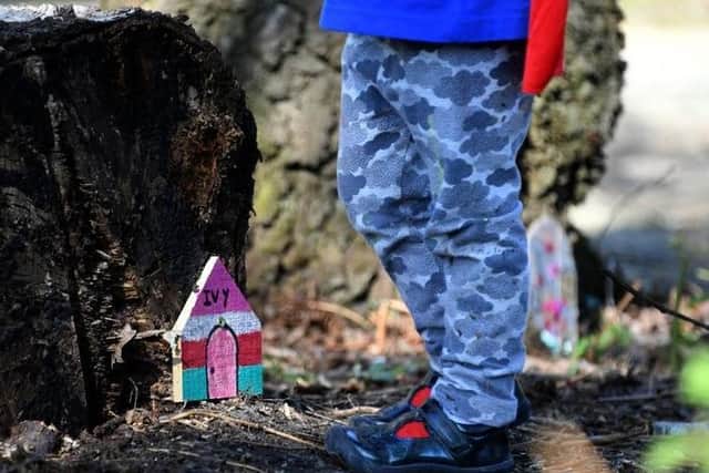 Families in Buckshaw were told that the decorations and wooden ornamental houseswould have to be removed as they were deemed 'inappropriate" for the woodland