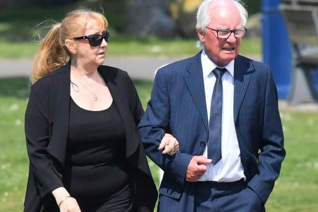 Syd Little and his wife, Sheree, arrive to see the hearse containing his comedy legend partner Eddie Large