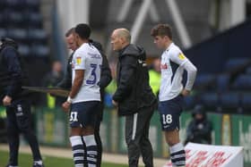 Scott Sinclair and Ryan Ledson prepare to come on as substitutes in Preston North End's game against Queens Park Rangers at Deepdale
