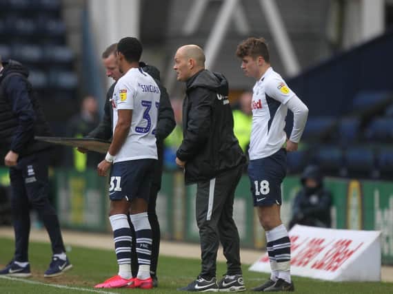 Scott Sinclair and Ryan Ledson prepare to come on as substitutes in Preston North End's game against Queens Park Rangers at Deepdale