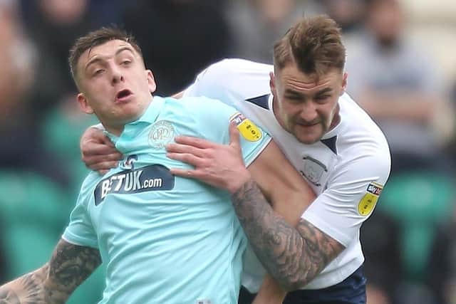Jordan Hugill tussles with Patrick Bauer during Preston’s clash with Queens Park Rangers at Deepdale in March