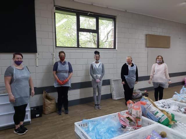 Loretta Whiteley (second left) and Sophie Wilding (middle) with volunteers at Moss Side Community Centre.