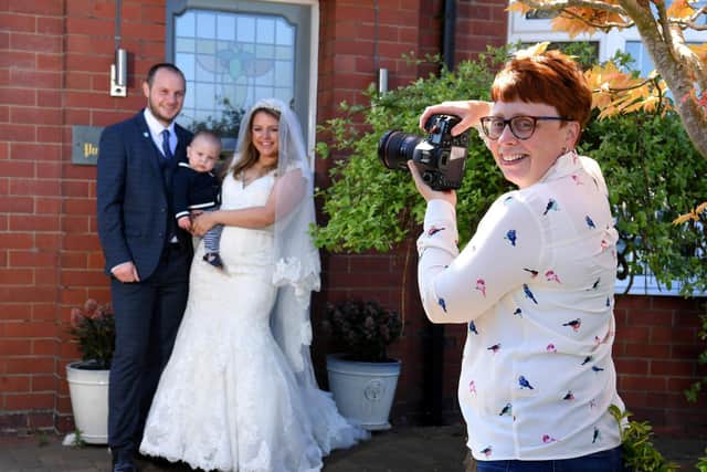 Photo Neil Cross: Christina Davies of Fish 2 Photography has raised over 300 by photographing families on their doorsteps during lockdown, including Ben and Bridget Mashiter in their wedding outfits with son Albert, 10 months